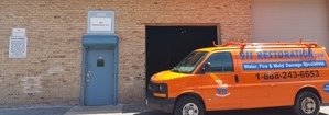 Water and Mold Damage Restoration Van Parked Outside Headquarters